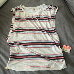 Nwt free people movement striped tank with bungees to crop up or down on sides.